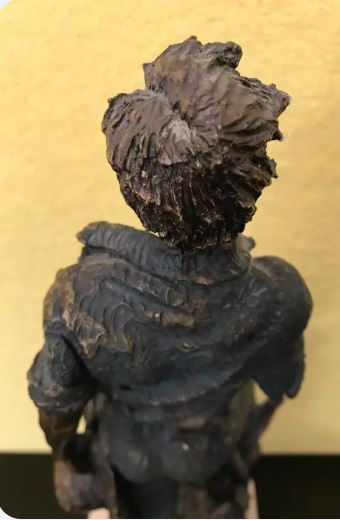 Statuie semnata M. Senserrich, reprezentand un tanar la munca campului